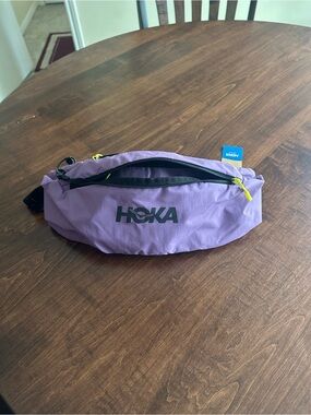 Hoka Lavender Fanny Pack with Black Logo and Neon Yellow Zippers